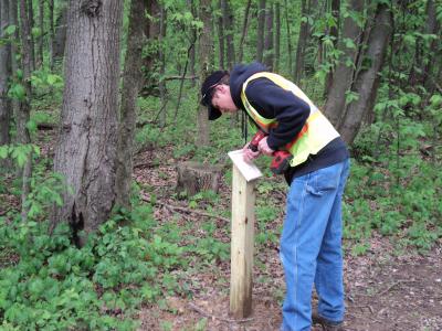 New Albany Arboretum at Swickard Woods- installing sign